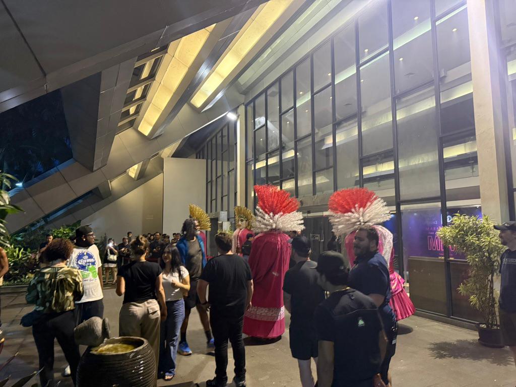 Fans and crew outside the venue
